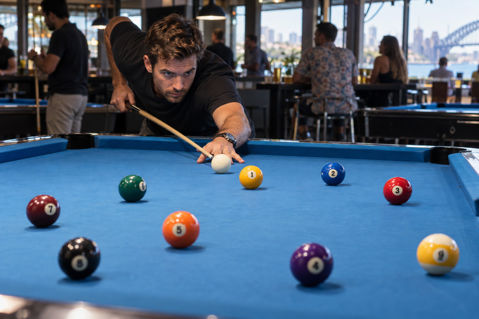 Player lining up a shot towards the one ball on a blue pool table